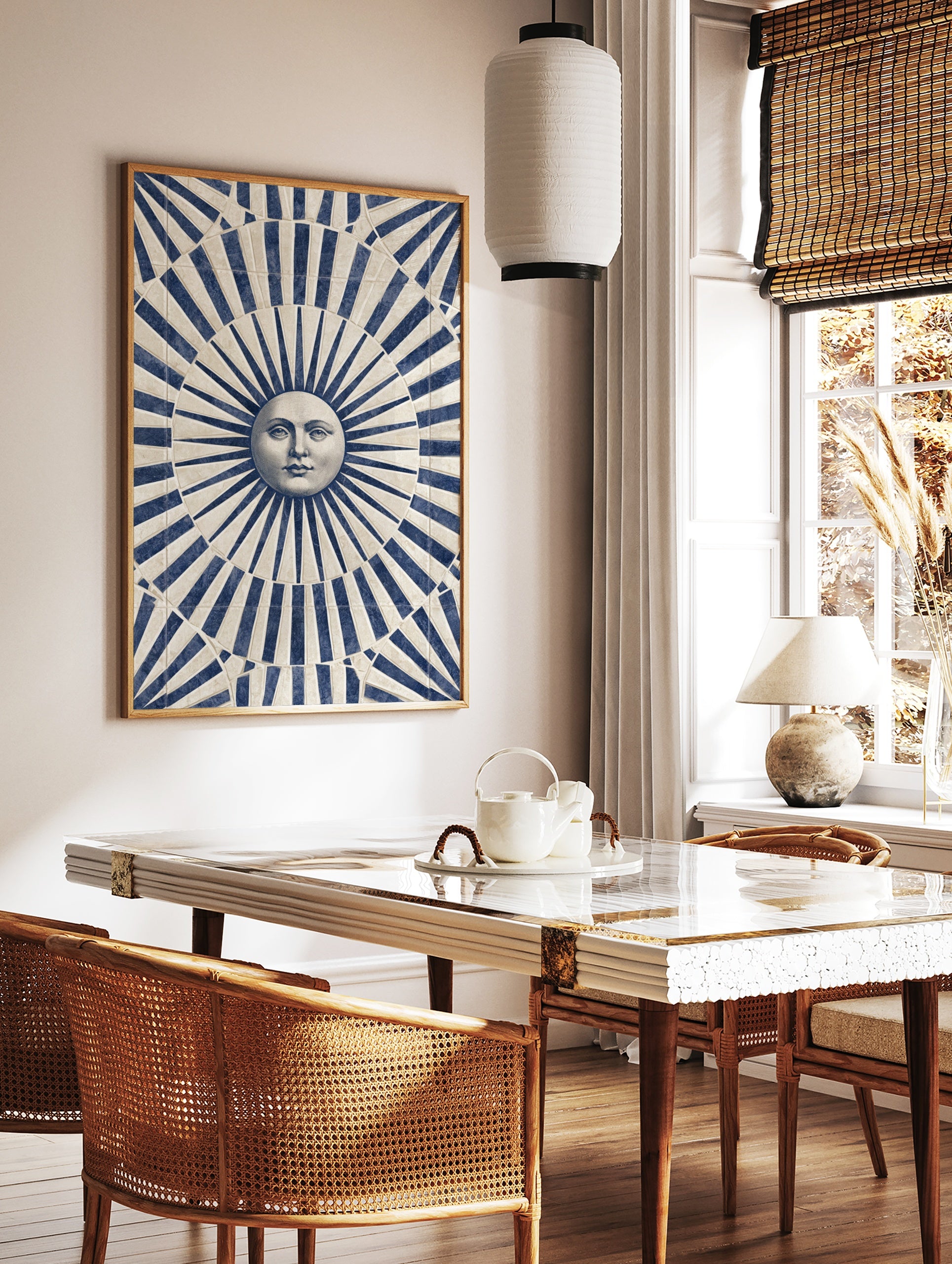 Classical sun face illustration with blue and beige radiating stripes art print, in a styled room mockup