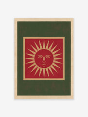 Illustrative red sun face wall art print with tan and green borders on a cream background
