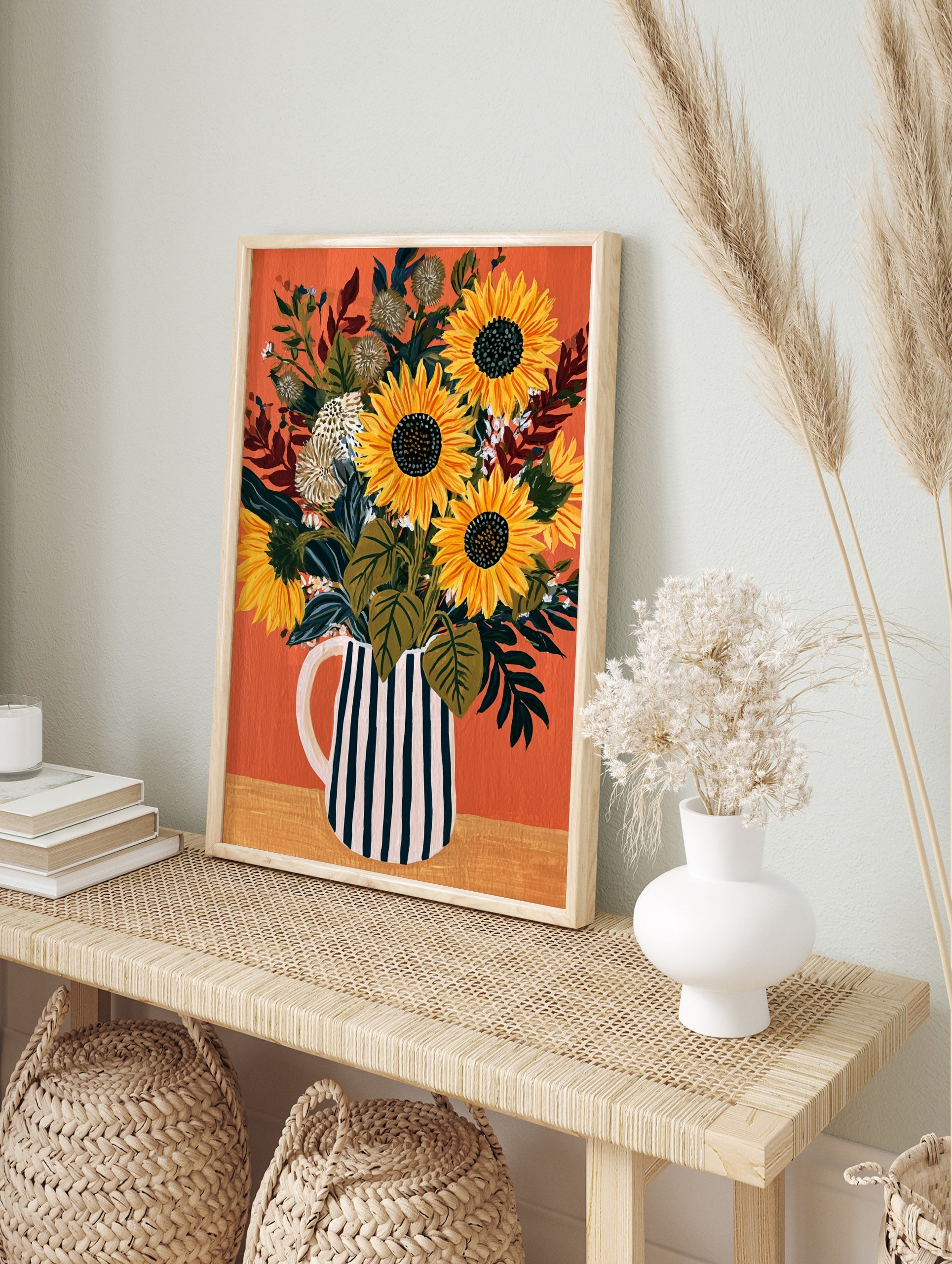 Sunflower bouquet in a black and white striped pitcher on an orange background, illustrative, in an alternate framed mockup