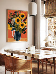 Sunflower bouquet in a black and white striped pitcher on an orange background, illustrative floral, in a styled room mockup