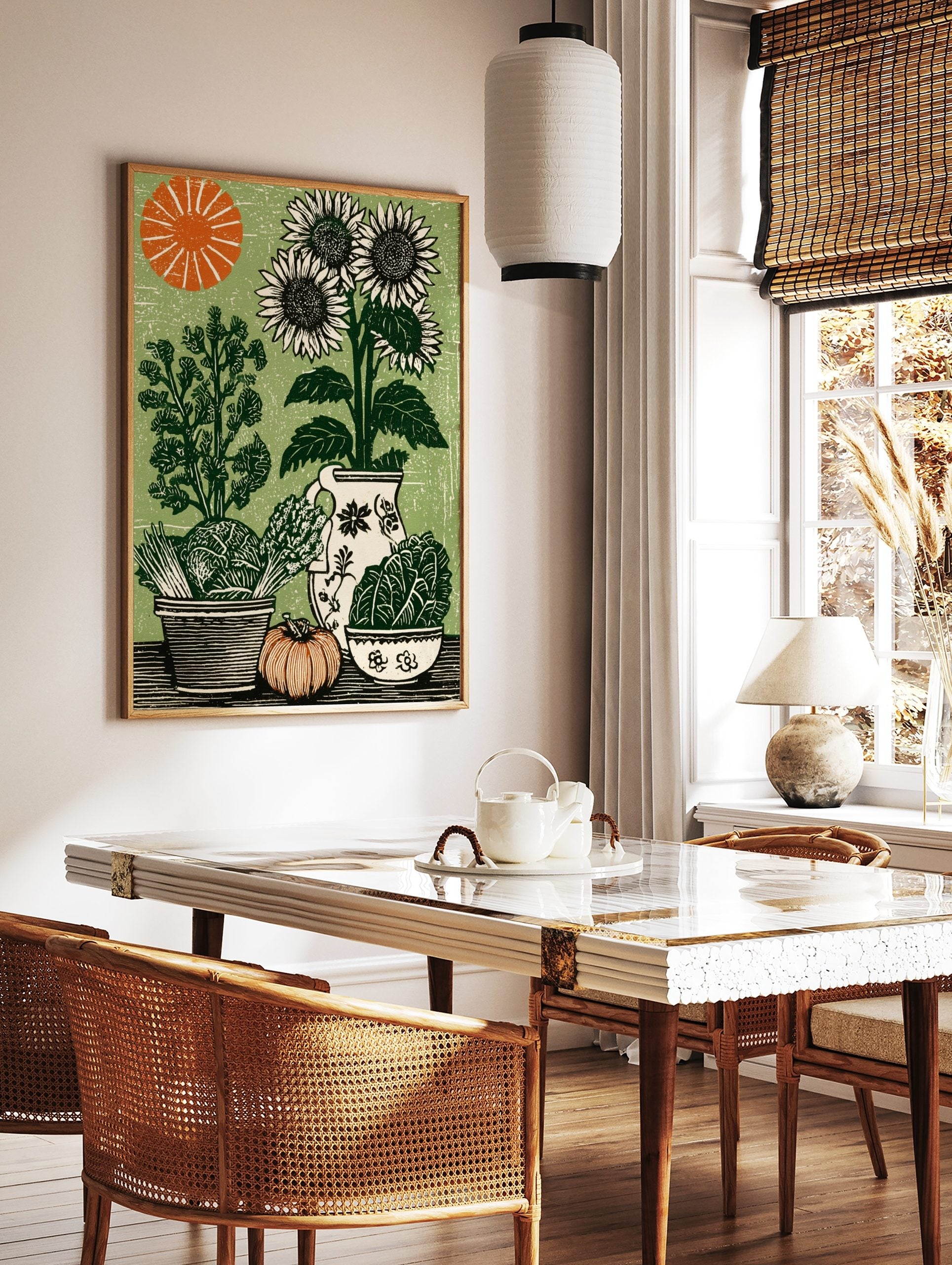 Woodcut style print of sunflowers, cabbage, asparagus, pumpkin, and pitcher on a green background, in a styled room mockup