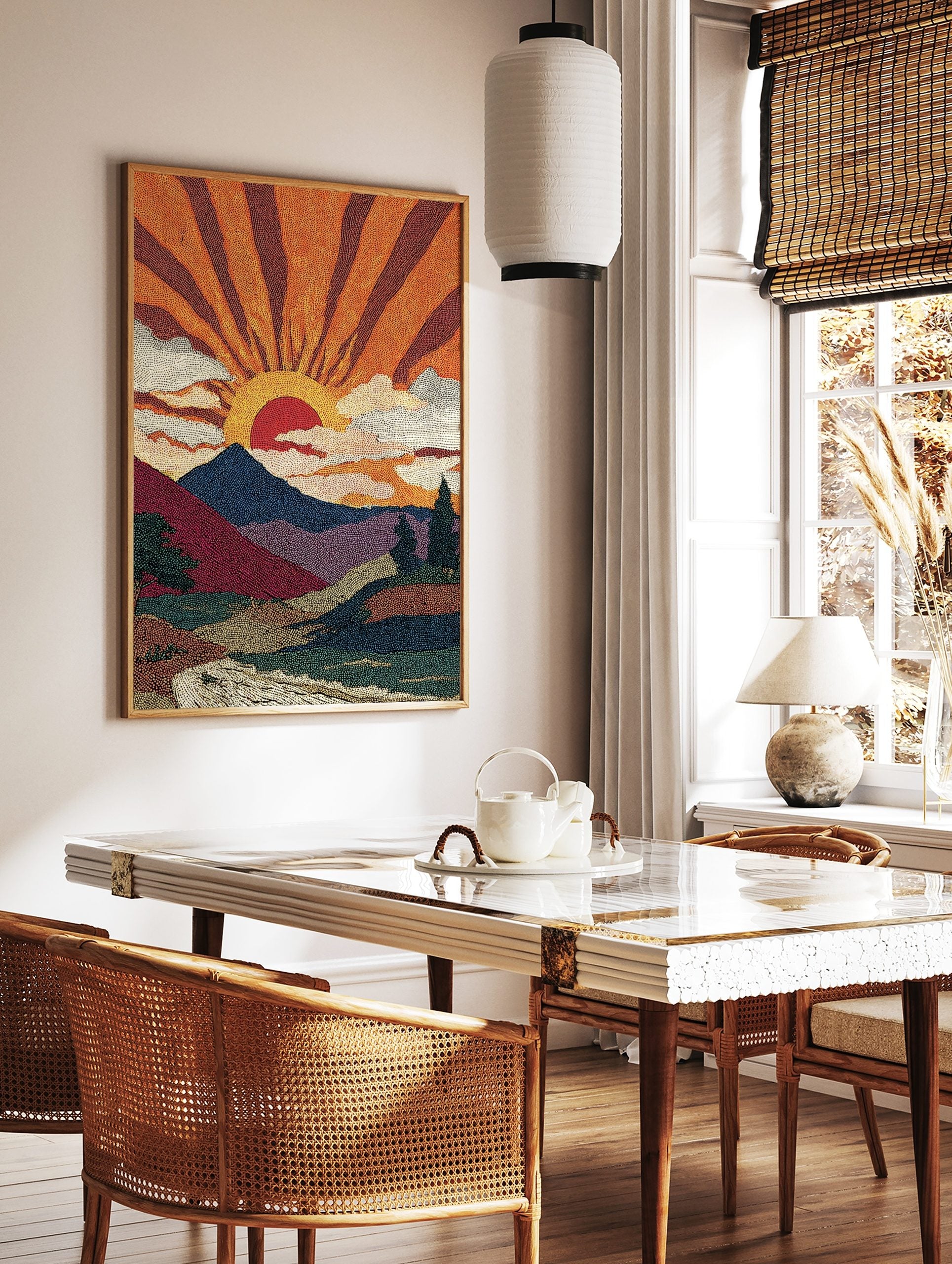 Pointillist sunrise mountain landscape art print with orange sun rays, blue mountains, and a river, in a styled room mockup