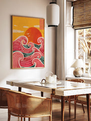 Illustrative print of a large red sun over stylised pink and teal ocean waves with a yellow sky, in a styled room mockup