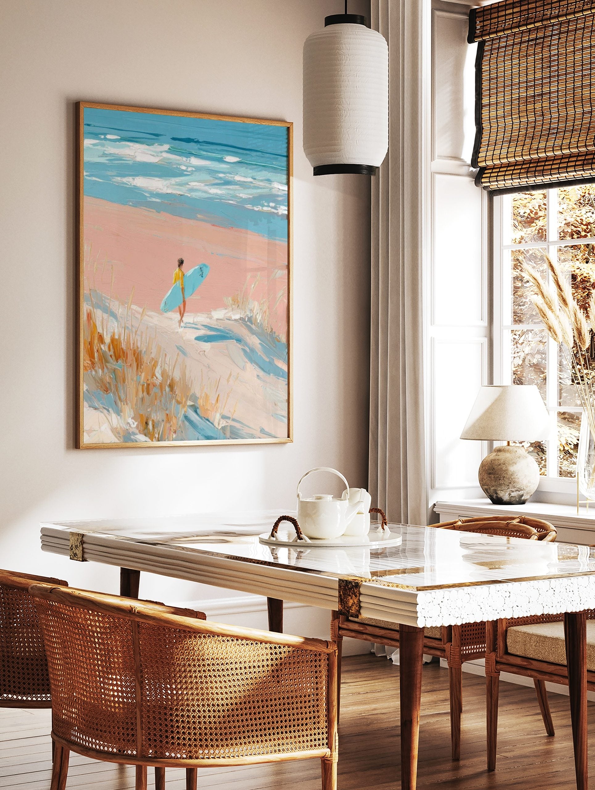 Impressionistic painting of surfer with blue board walking on pink beach towards ocean waves and, in a styled room mockup