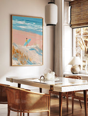 Impressionistic painting of surfer with blue board walking on pink beach towards ocean waves and, in a styled room mockup