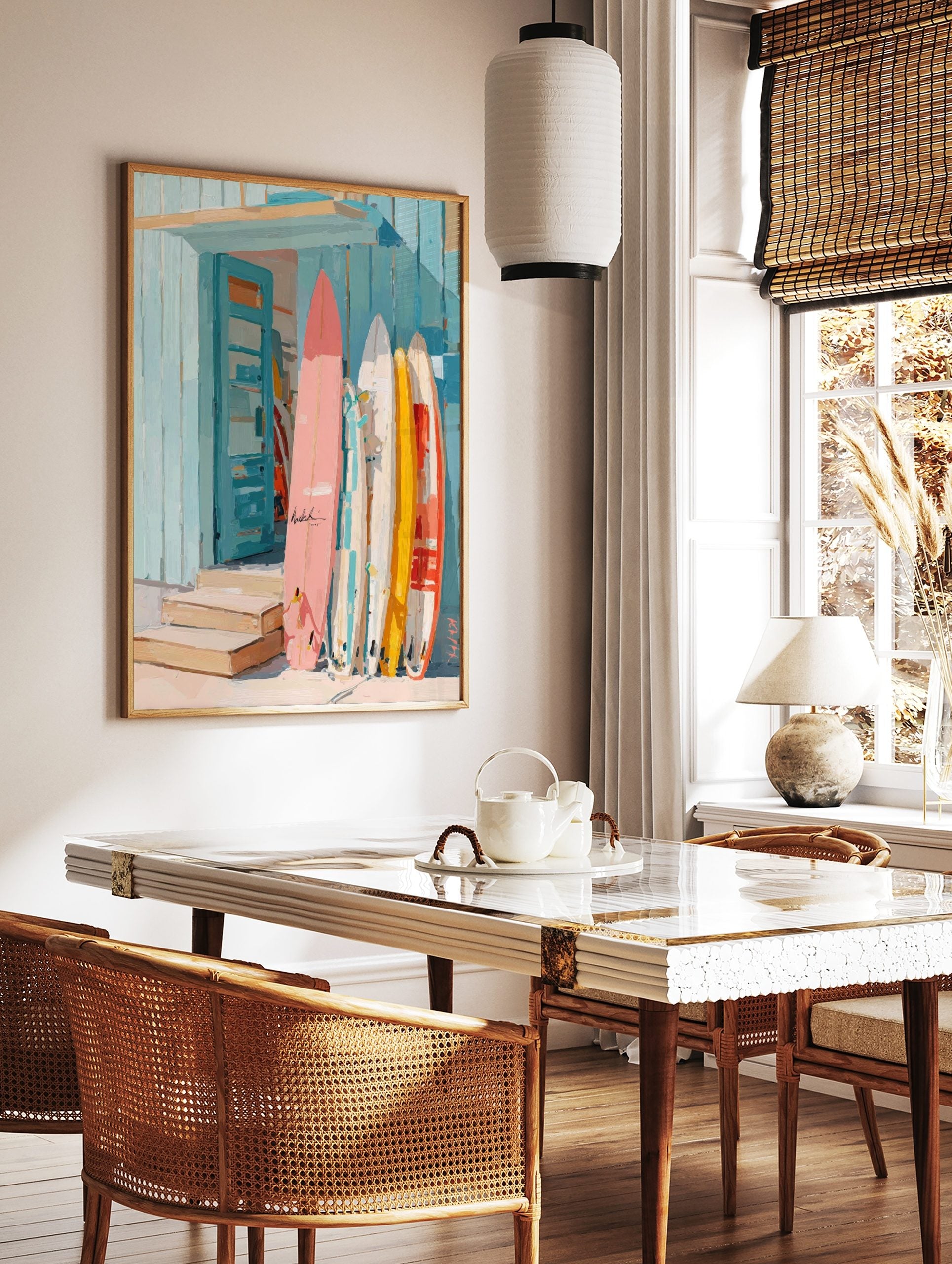Colourful surfboards in pink, yellow, and white leaning against a blue wooden beach shack with an, in a styled room mockup