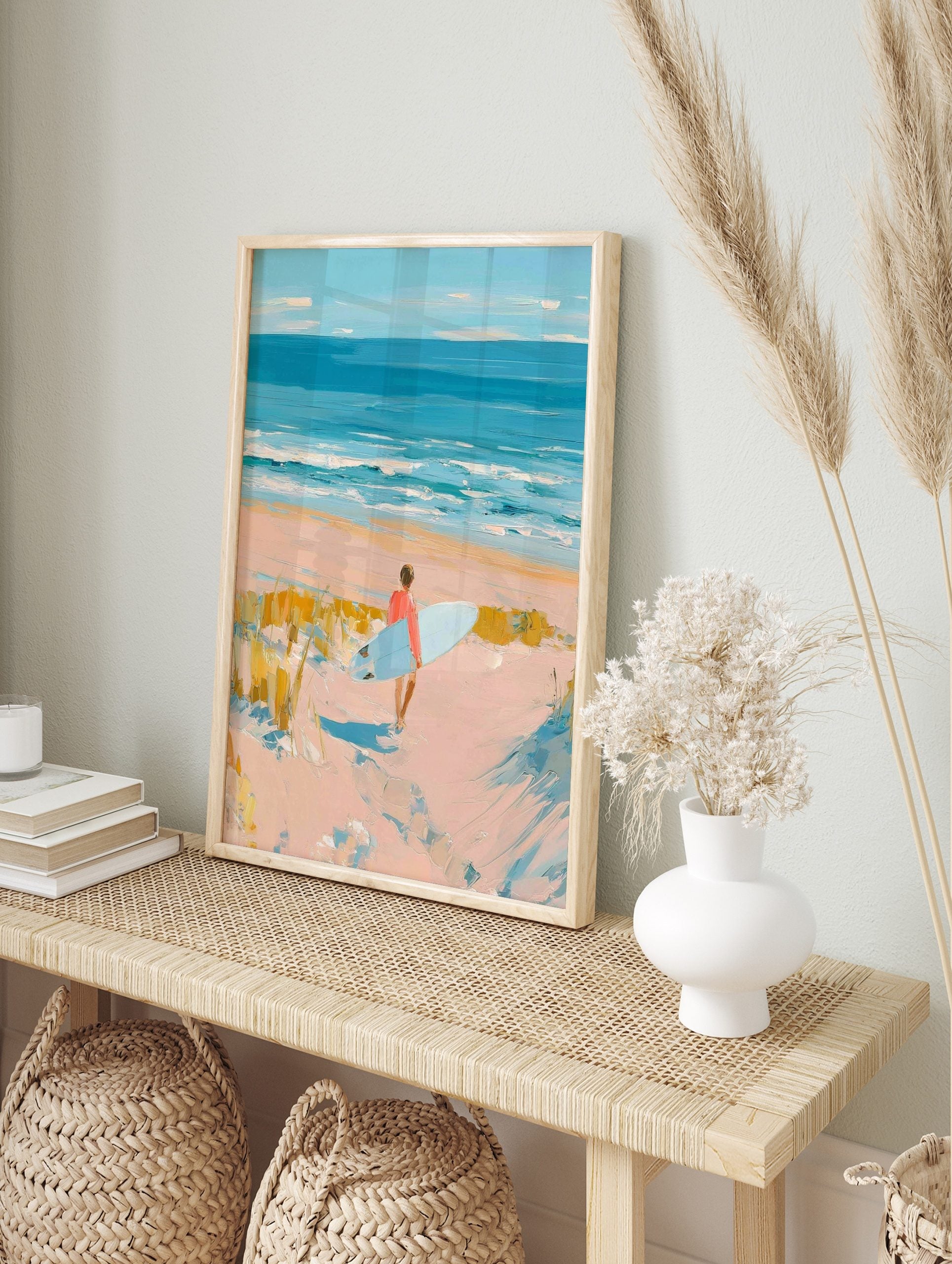 Impressionist painting of a surfer with a light blue board walking on a sandy beach towards, in an alternate framed mockup