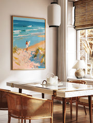Impressionist painting of surfer on sandy dune path overlooking turquoise ocean waves and blue sky, in a styled room mockup