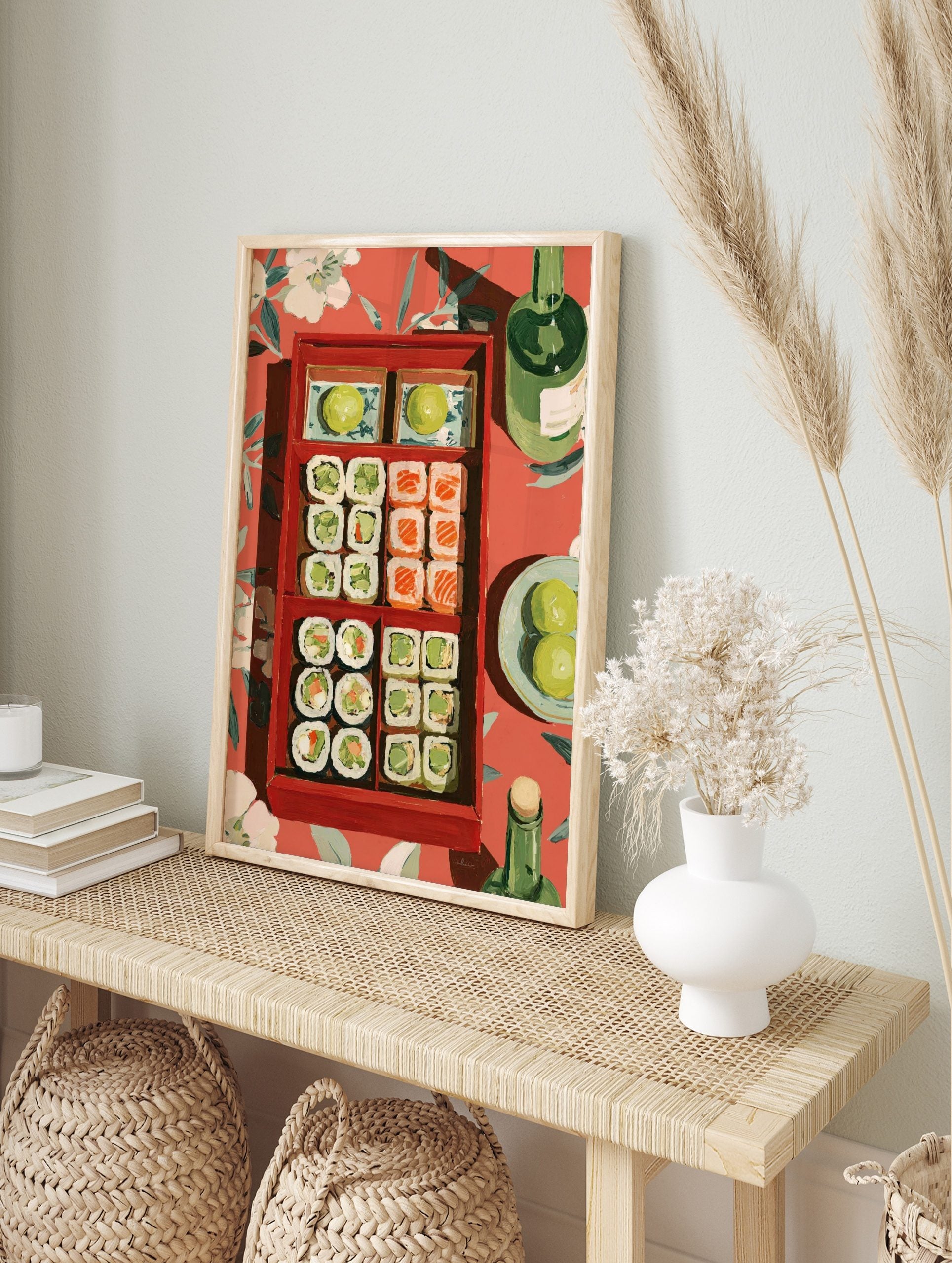 Illustrative wall art of a red bento box filled with sushi and limes, green bottles, on a red, in an alternate framed mockup