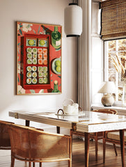 Illustrative wall art of a red bento box filled with sushi and limes, green bottles, on a red, in a styled room mockup