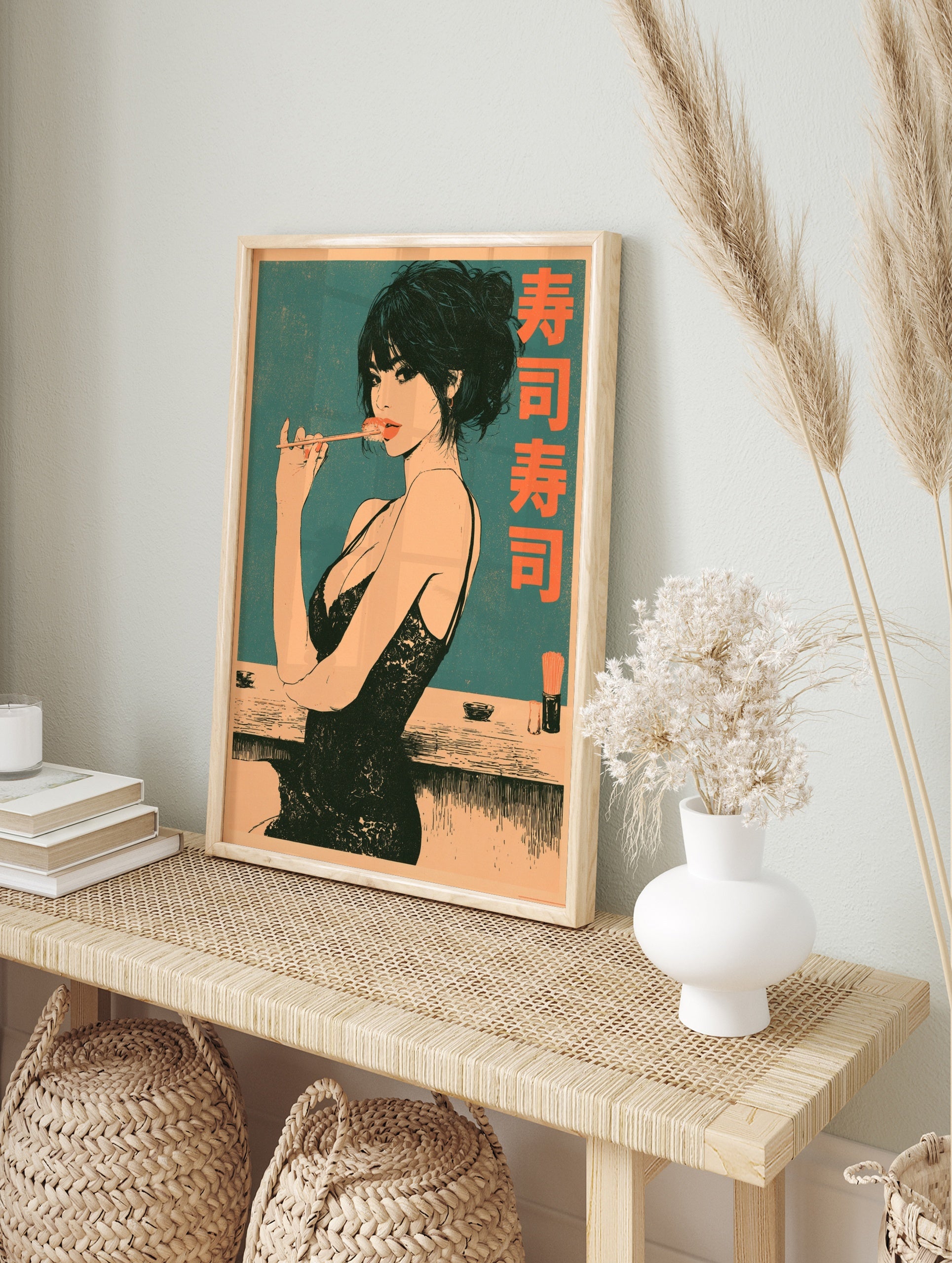 Illustrative poster of a woman eating sushi with chopsticks and Japanese kanji text on a teal, in an alternate framed mockup
