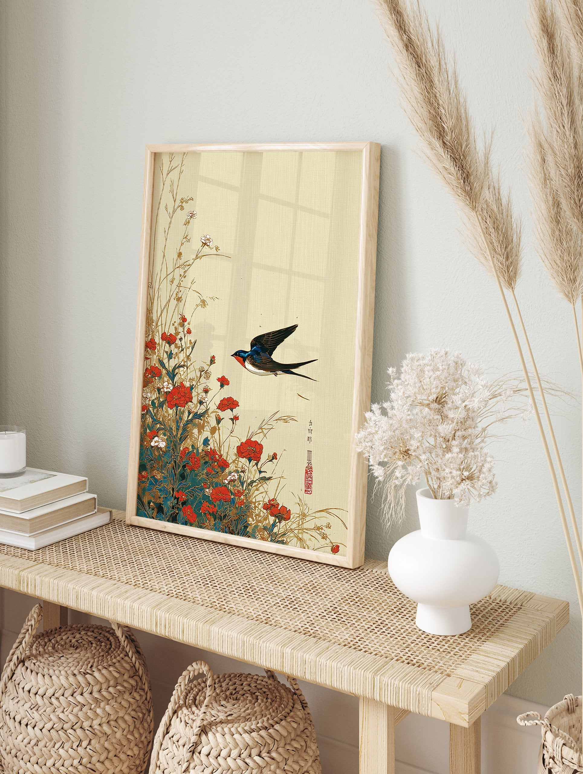 Traditional Asian swallow bird wall art print flying over red and white flowers and grass on a light beige textured background. - Image 3