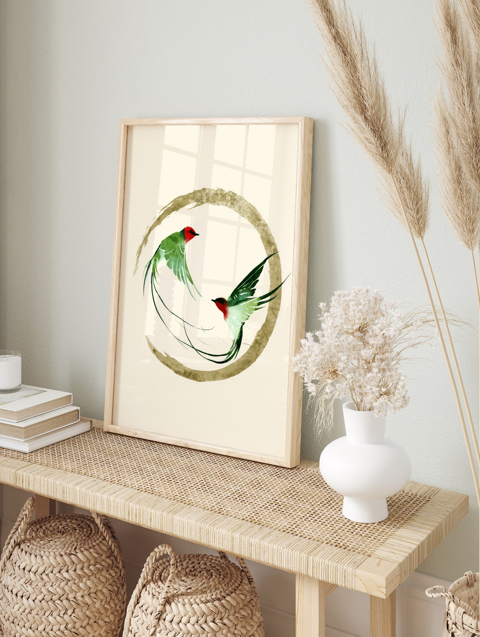 Two green swallow birds in flight inside a golden brushstroke circle, Japanese inspired art, in an alternate framed mockup