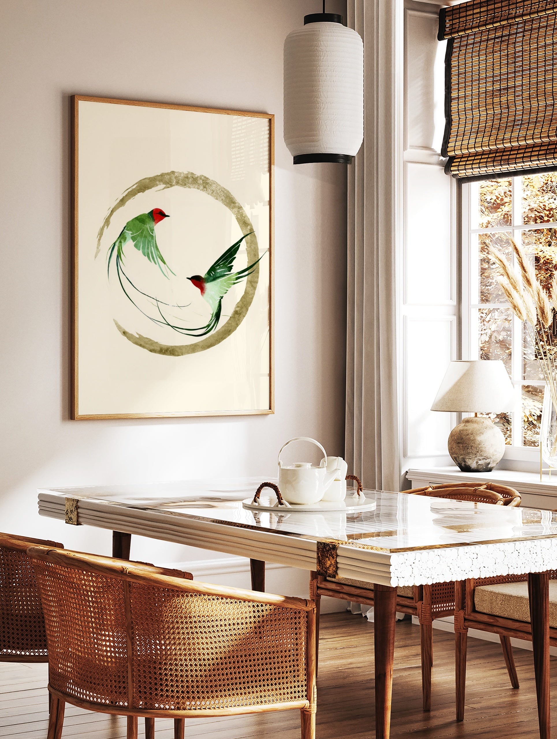 Two green swallow birds in flight inside a golden brushstroke circle, Japanese inspired art print, in a styled room mockup