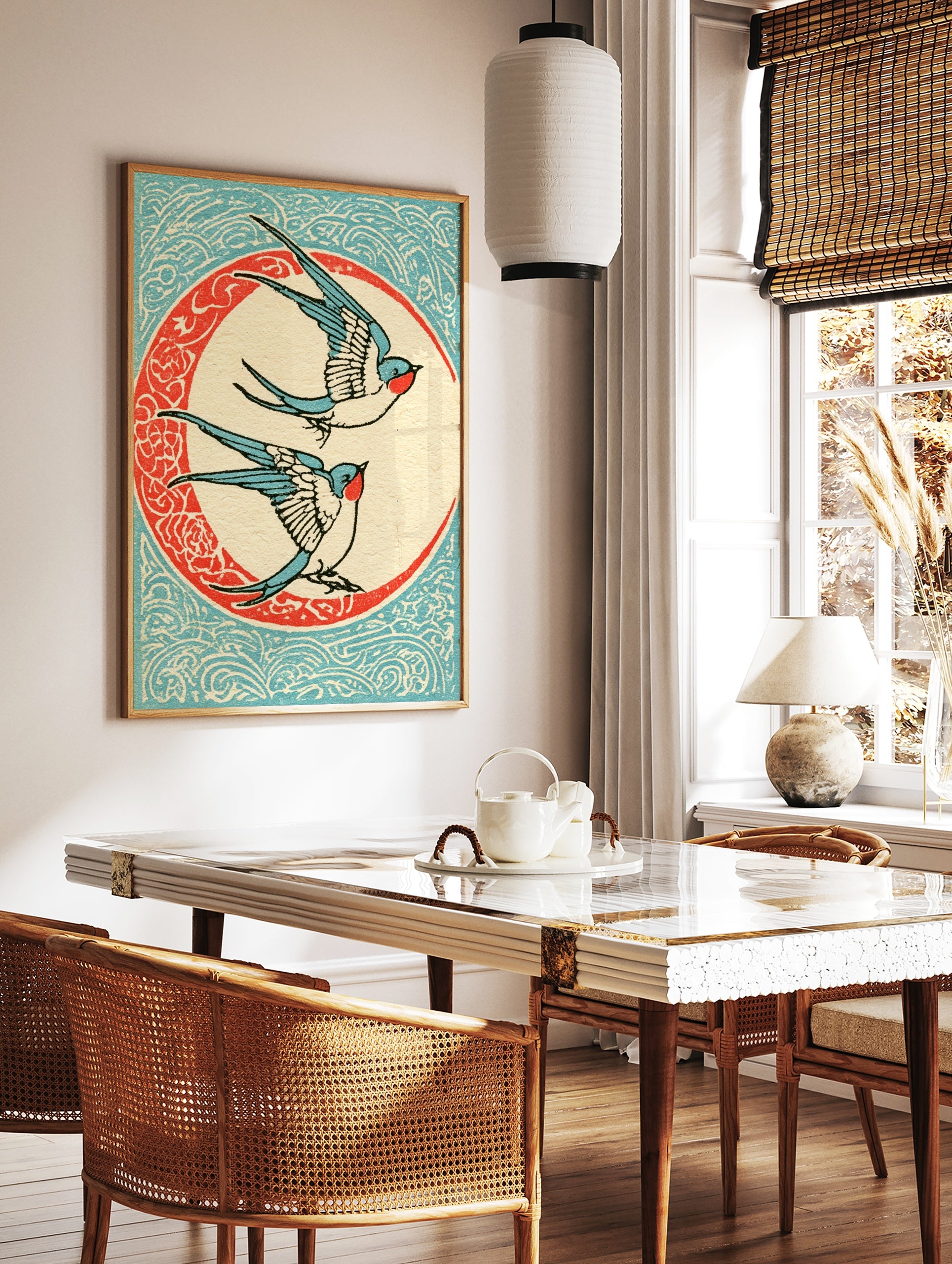 Vintage illustrative art print of two swallow birds flying inside a decorative circular frame on a, in a styled room mockup