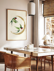 Two swallows in ink-wash style flying within a gold enso circle, Japanese minimalist art print on, in a styled room mockup