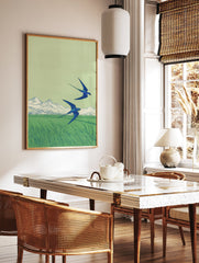 Two blue swallows flying over a green field with distant mountains, in a Japanese-inspired illustration style art print. - Image 2