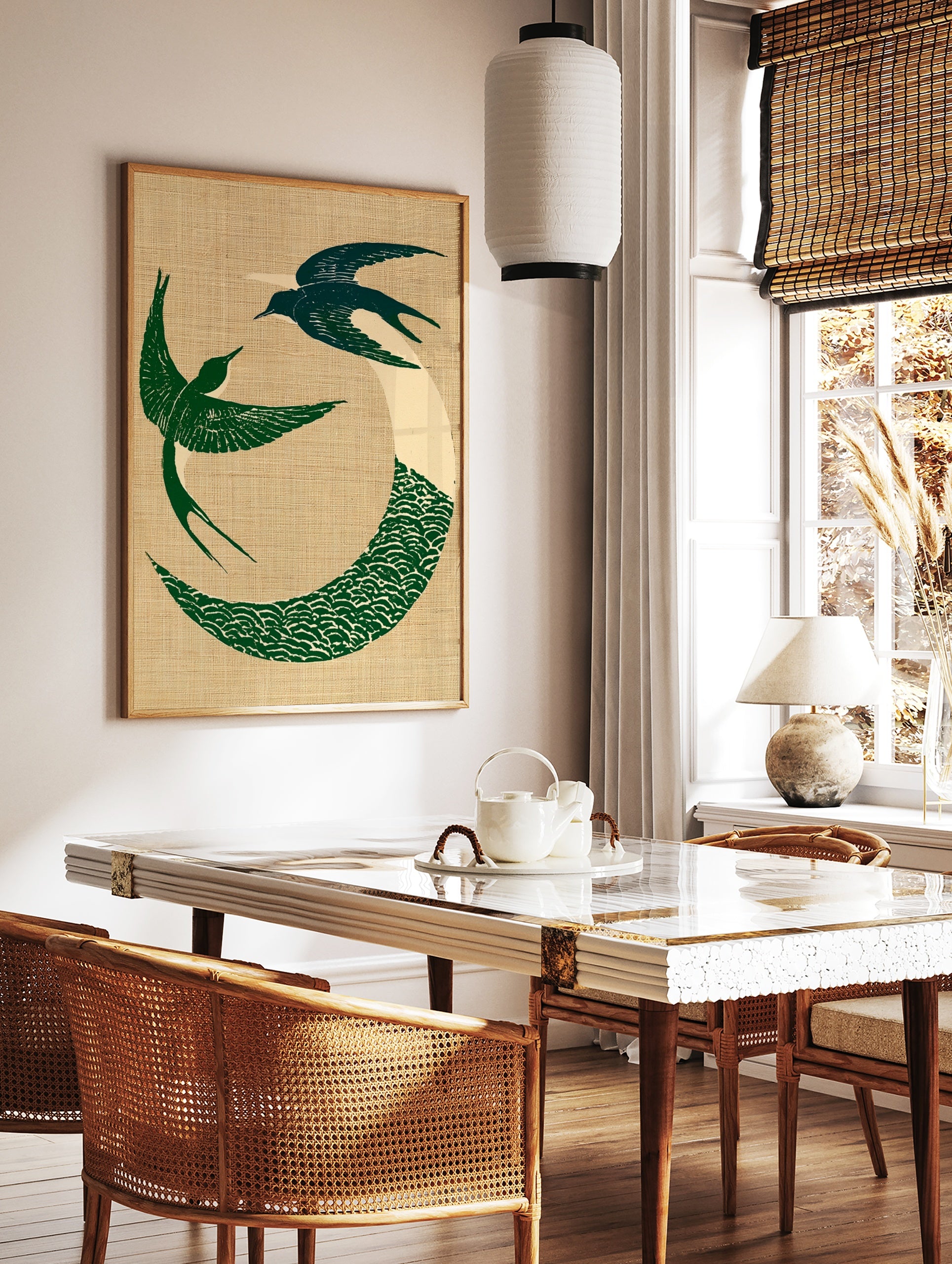 Circular art print of two green swallows in flight with a wave motif on a textured beige background, in a styled room mockup