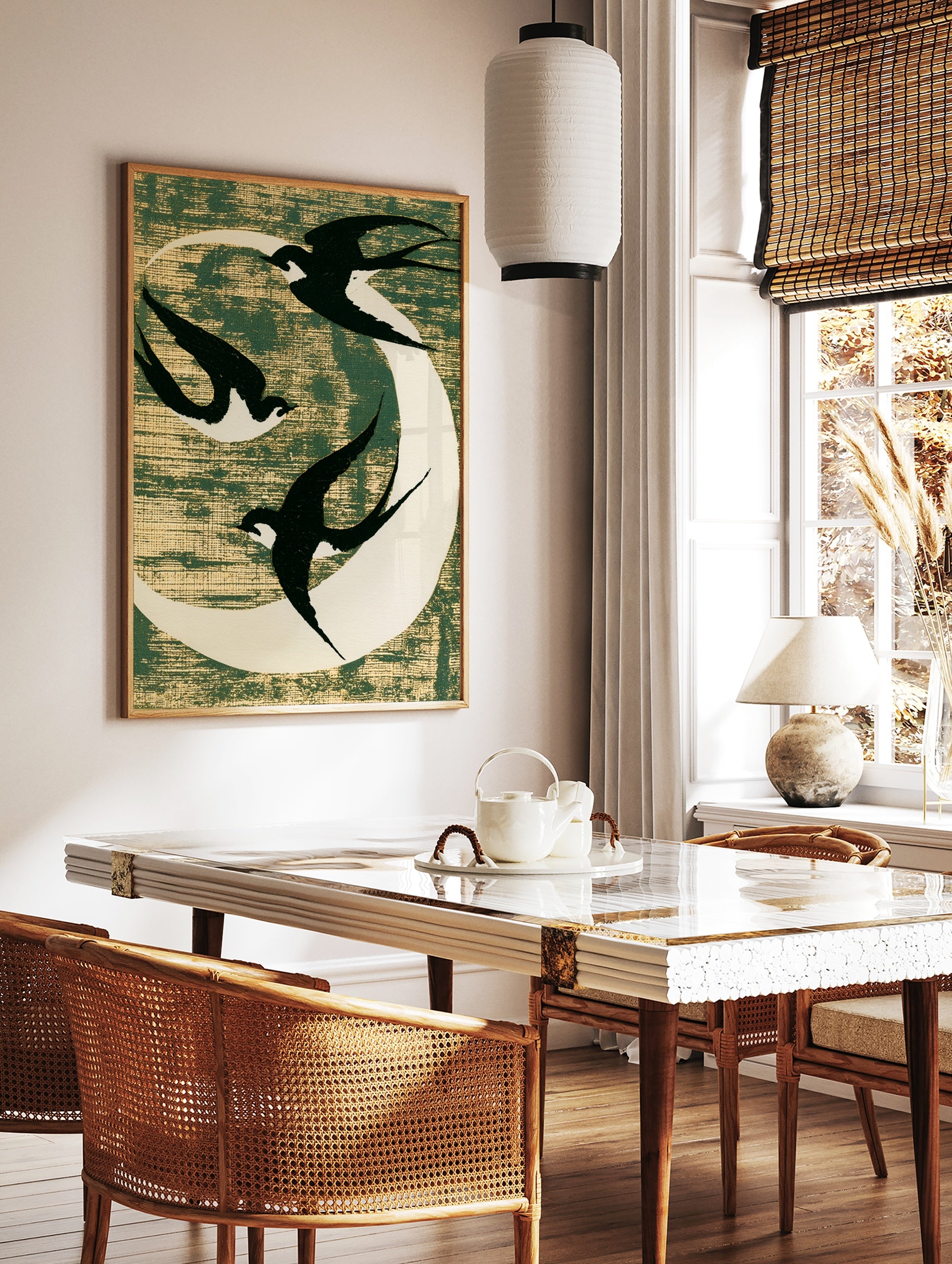 Three black swallows flying against a white moon on a textured dark green background, minimalist, in a styled room mockup
