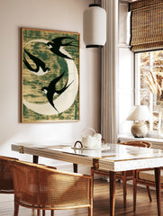 Three black swallows flying against a white moon on a textured dark green background, minimalist, in a styled room mockup
