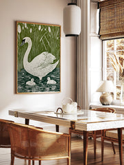 White swan and two cygnets swimming in green water with tall reeds and cattails in illustrative, in a styled room mockup