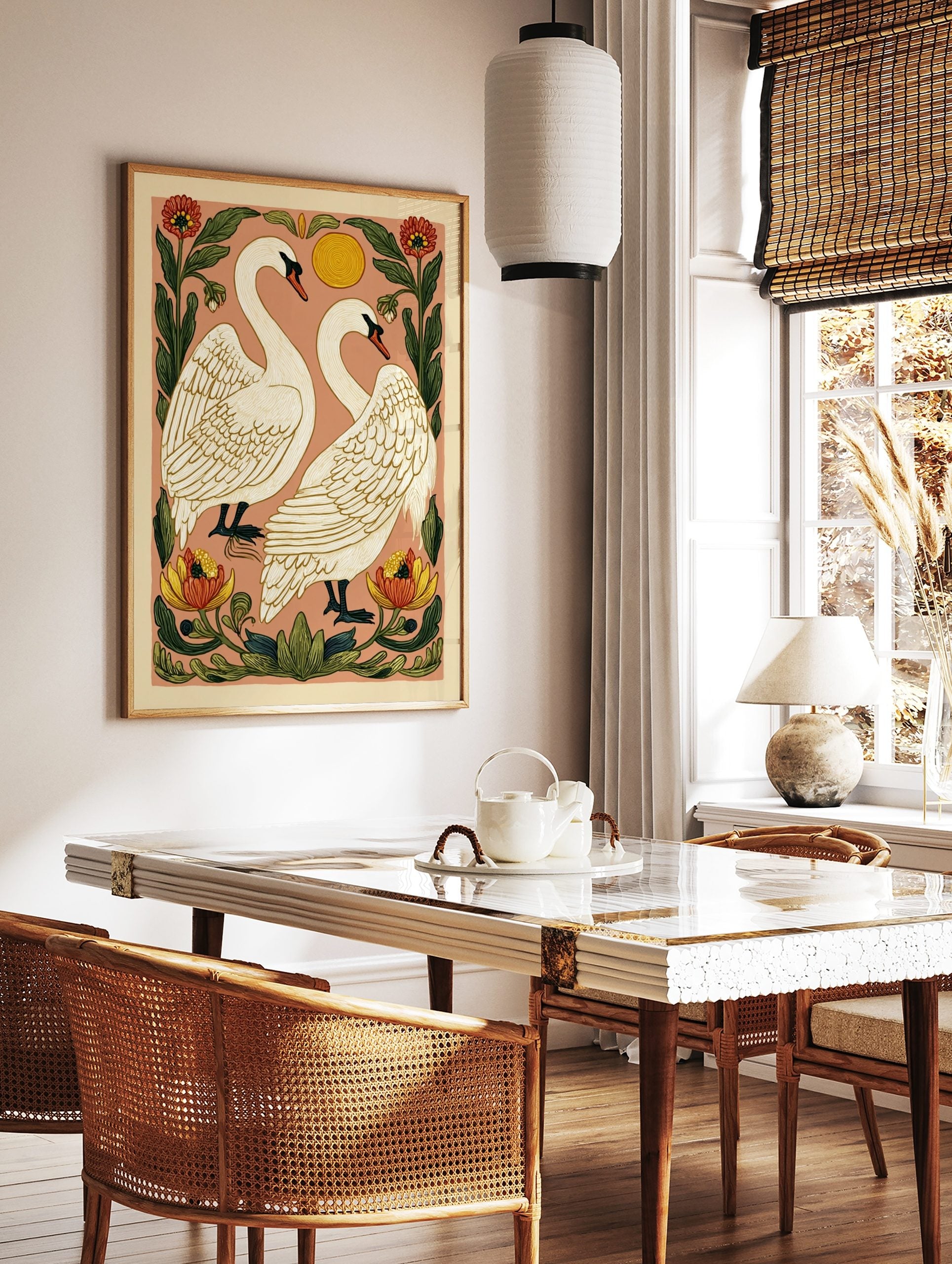 Illustrative art print of two white swans facing each other, surrounded by red and yellow flowers, in a styled room mockup