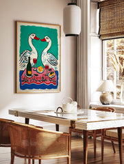 Illustrative print of two white swans with red beaks over a pink floral dinner table with wine and, in a styled room mockup