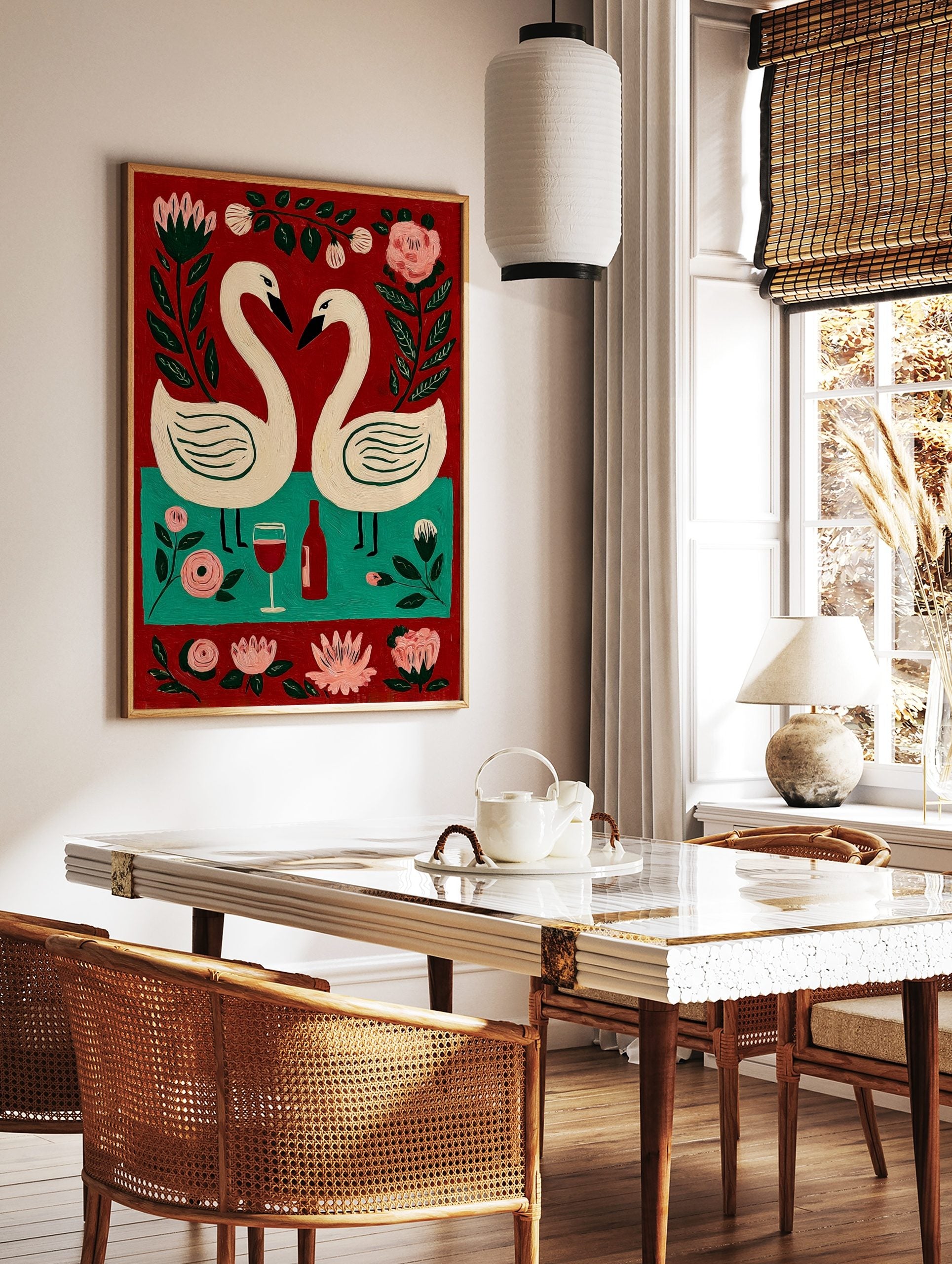Folk art painting of two white swans forming a heart, red wine bottle, glass, and pink flowers on, in a styled room mockup