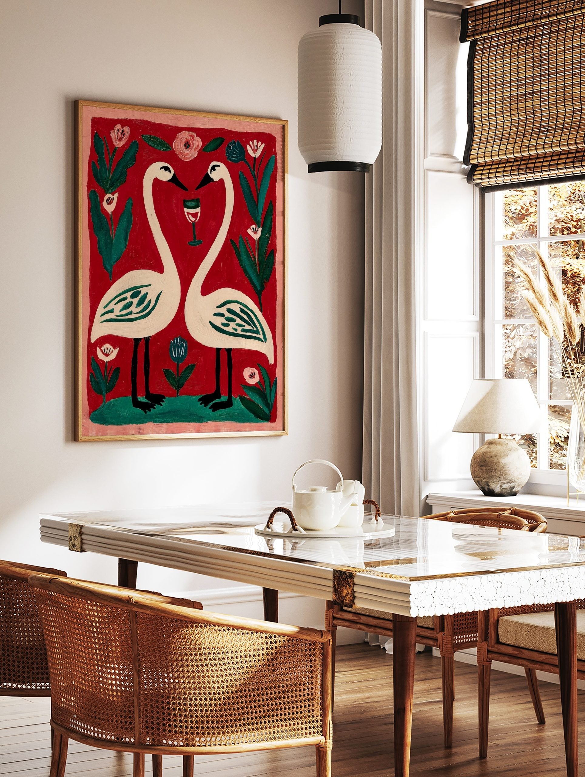 Illustrative print of two white swans forming a heart, with a wine glass, pink and blue flowers on, in a styled room mockup
