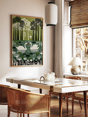 Illustrative green wall art print of two white swans on a pond surrounded by tall trees and foliage, in a styled room mockup