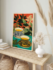 Botanical tea cup poster featuring two ornate teacups, green leaves, and white flowers against an orange and teal background. - Image 4