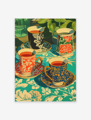 Poster of four decorative tea cups with various patterns (red, blue, black) on a vibrant teal floral tablecloth with green plants in background.