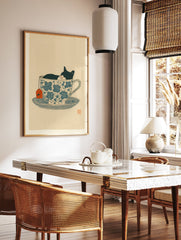 Black and white cat sleeping in a blue floral teacup with an orange tea tag, whimsical illustration print. - Image 2