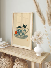 Black and white cat sleeping in a blue floral teacup with an orange tea tag, whimsical illustration print. - Image 3