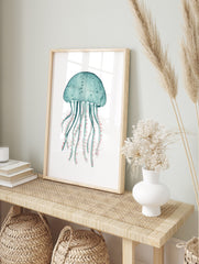 Teal watercolour jellyfish illustration art print with coral pink tentacles on a white, in an alternate framed mockup