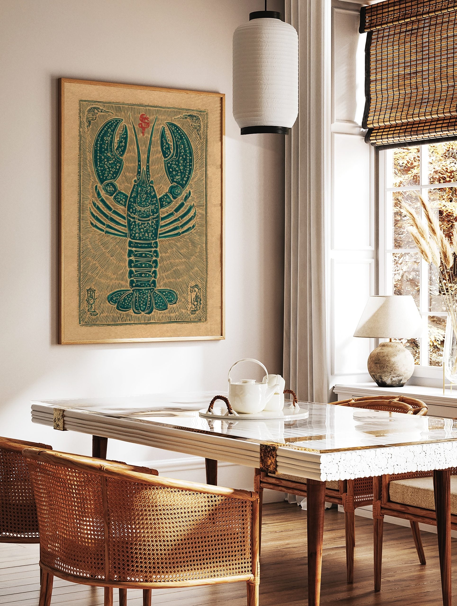 Teal lobster woodcut style art print on a tan background with red symbol and decorative border, in a styled room mockup