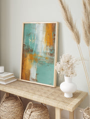 Abstract wall art print with vertical and horizontal teal, orange, brown, and white, in an alternate framed mockup