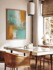 Abstract wall art print with vertical and horizontal teal, orange, brown, and white brushstrokes on, in a styled room mockup