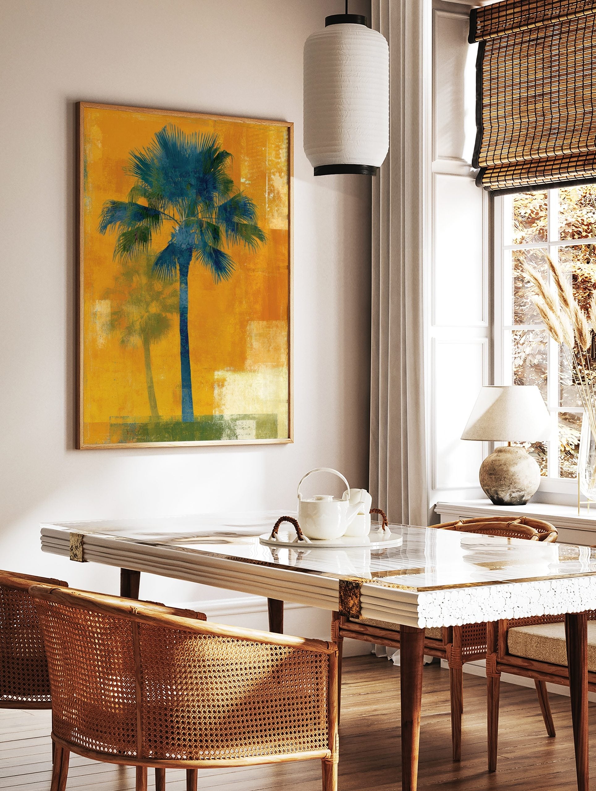 Teal palm tree art print on a textured orange background with a faded shadow palm, in a styled room mockup