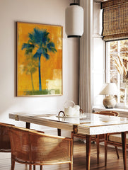 Teal palm tree art print on a textured orange background with a faded shadow palm, in a styled room mockup