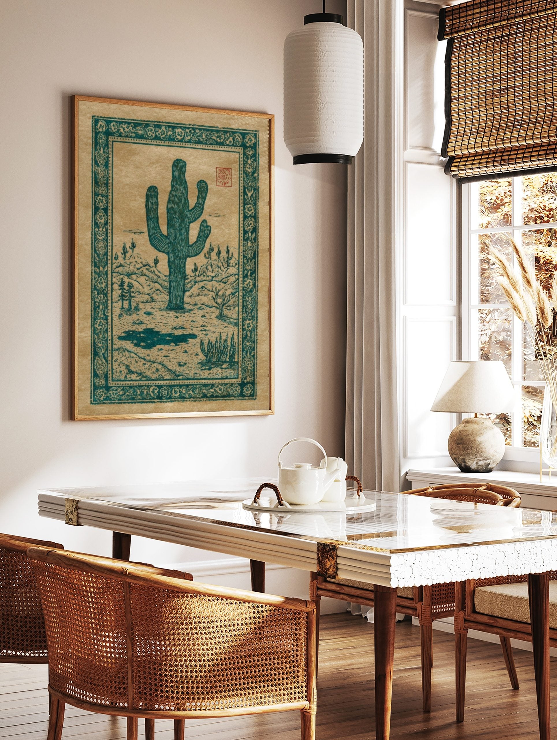 Teal Saguaro cactus illustration in a desert landscape with hills and ornate border on tan paper, in a styled room mockup