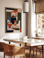 Minimalist geometric illustration of a teapot and bowl in navy, orange, and olive green on a, in a styled room mockup