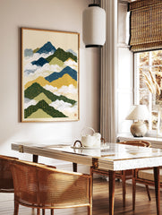 Illustrative mountain landscape with circuit board patterns in blue, green, and yellow, on a cream, in a styled room mockup