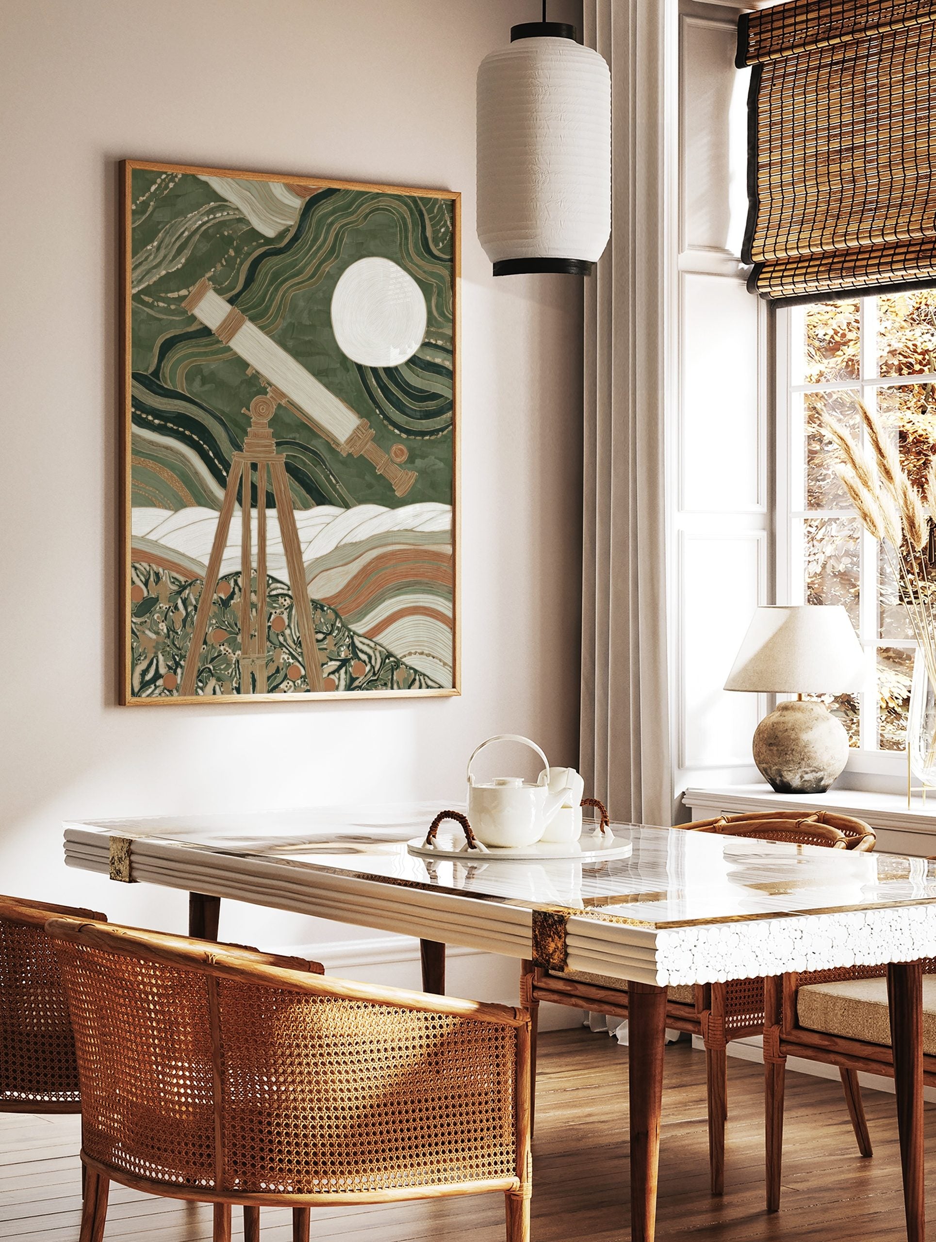 Vintage telescope on tripod observing a white moon against swirling green and gold patterns and, in a styled room mockup