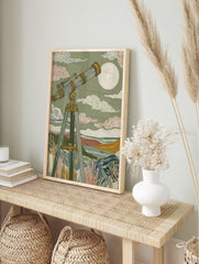 Illustrative wall art of a vintage telescope on a tripod, pointed at a celestial body in a, in an alternate framed mockup