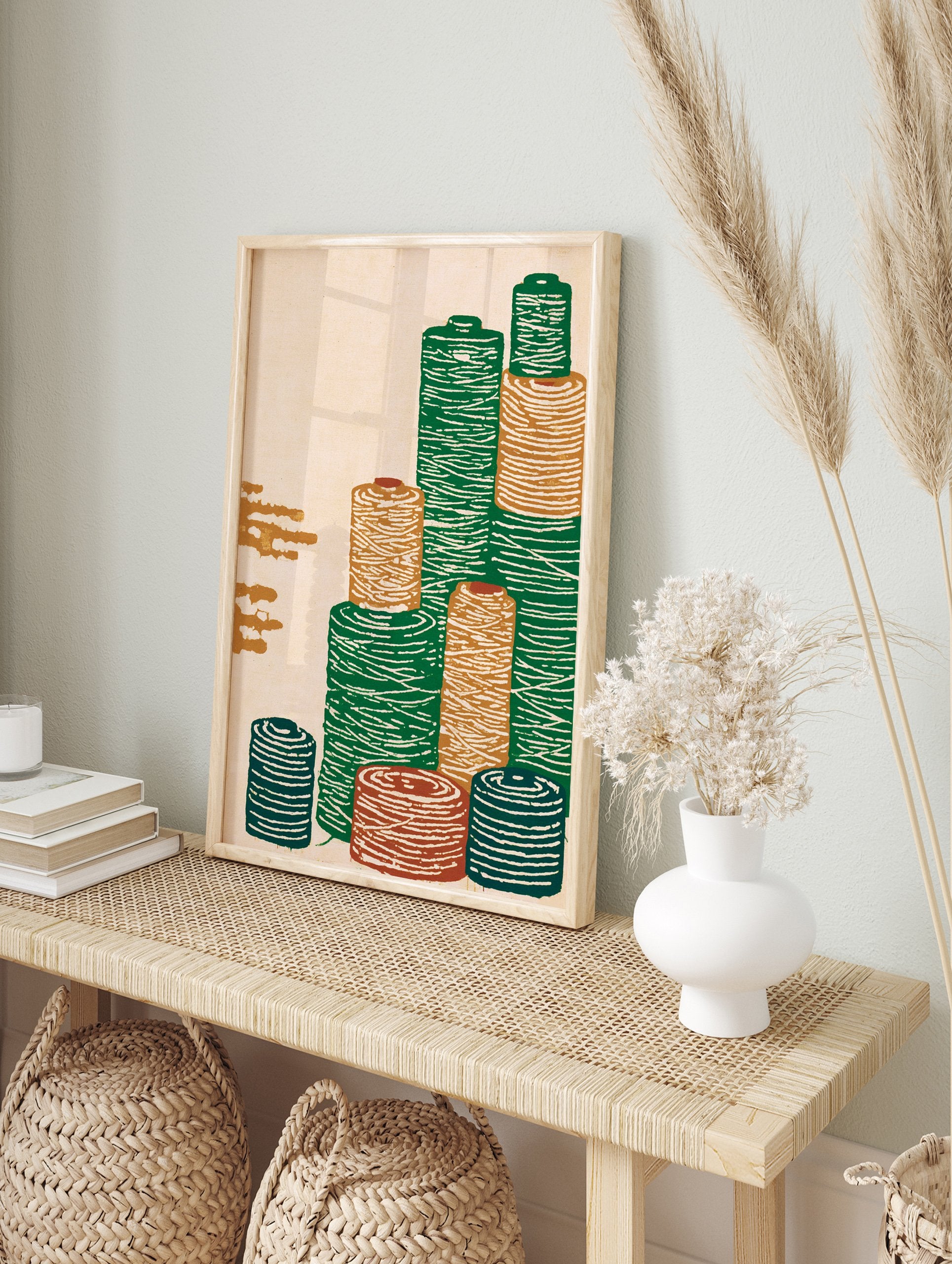 Illustrative textile spool wall art print showing stacked green, orange, and blue thread bobbins on a cream background - Image 3