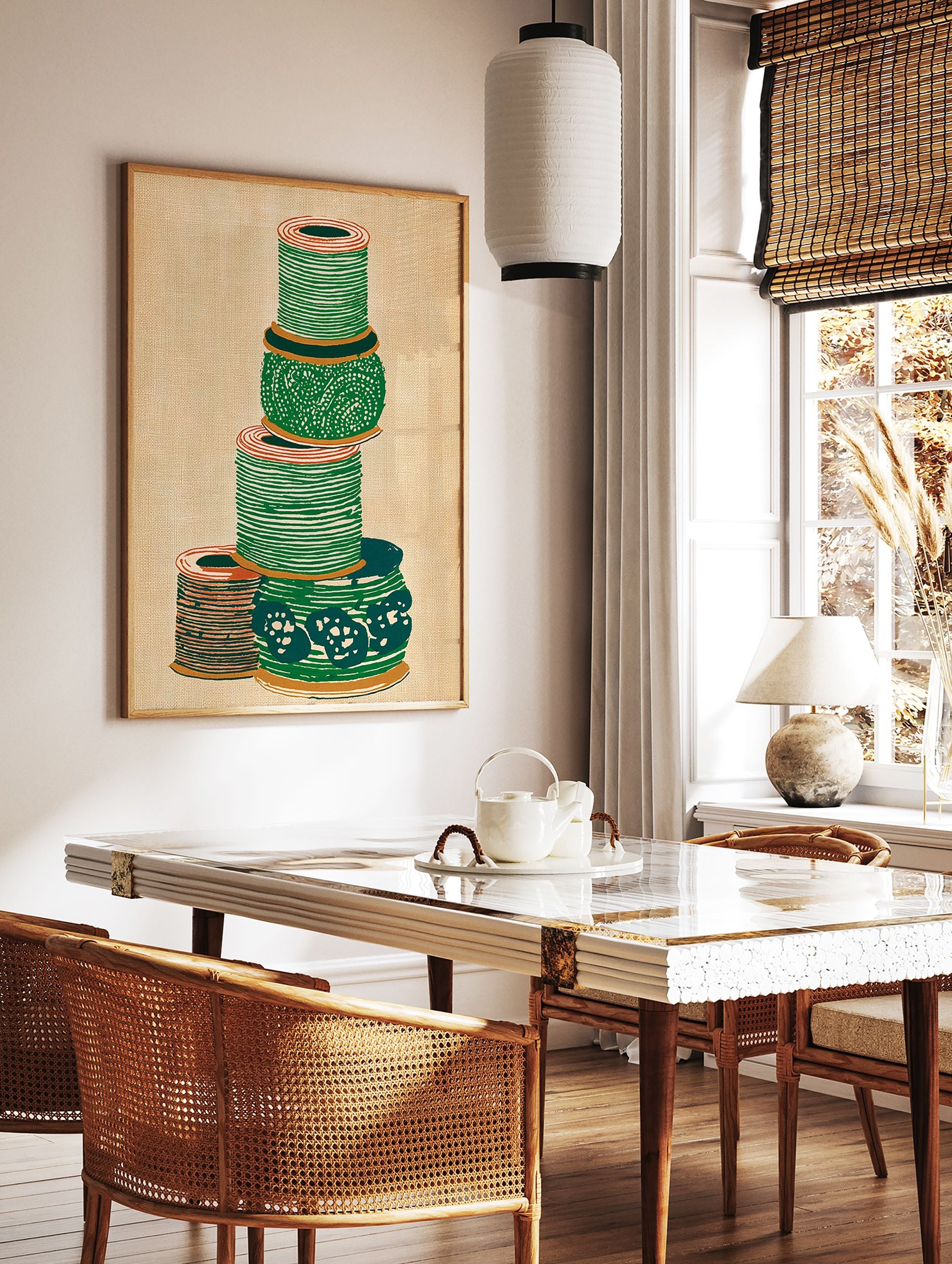 Illustrated green and orange thread spool wall art stacked on a textured beige background. - Image 2