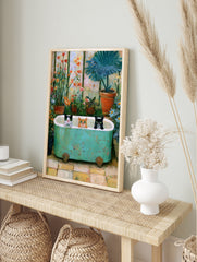 Three cats in a green bathtub inside a greenhouse with flowers and plants, painterly art print, in an alternate framed mockup