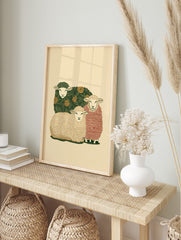 Illustrative art print of three sheep, one with green floral, one with red stripes, one with, in an alternate framed mockup