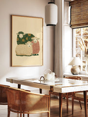 Illustrative art print of three sheep, one with green floral, one with red stripes, one with beige, in a styled room mockup